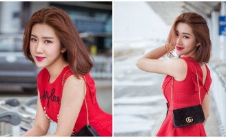 Thúy Ngân diện đầm đỏ nổi bật tại sân bay